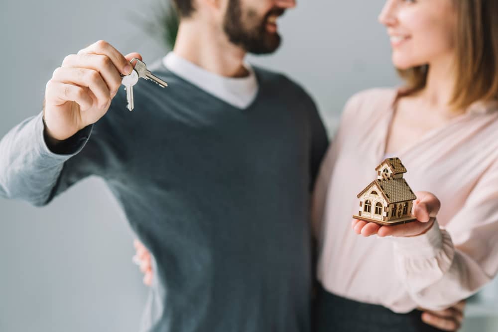 happy family receiving house keys